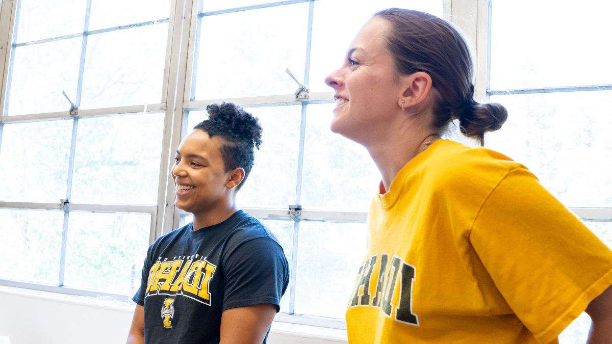 A student smiles at the camera